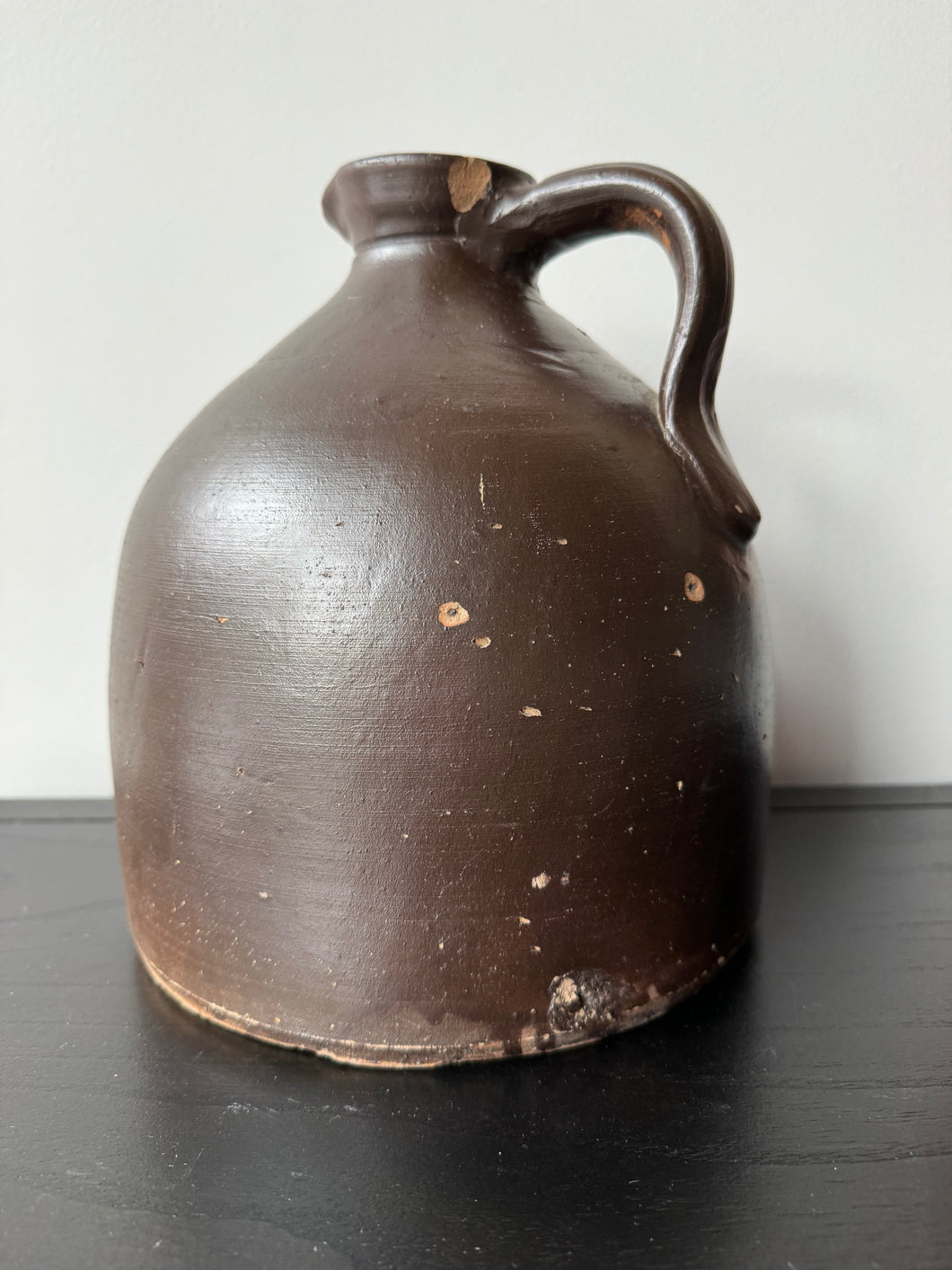 Antique stoneware jug with salt glaze and original cork